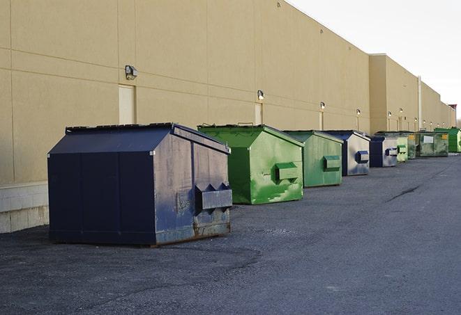 a row of blue construction dumpsters on a job site in Esopus NY