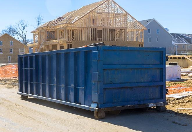 a delivery of a residential dumpster to a house under construction